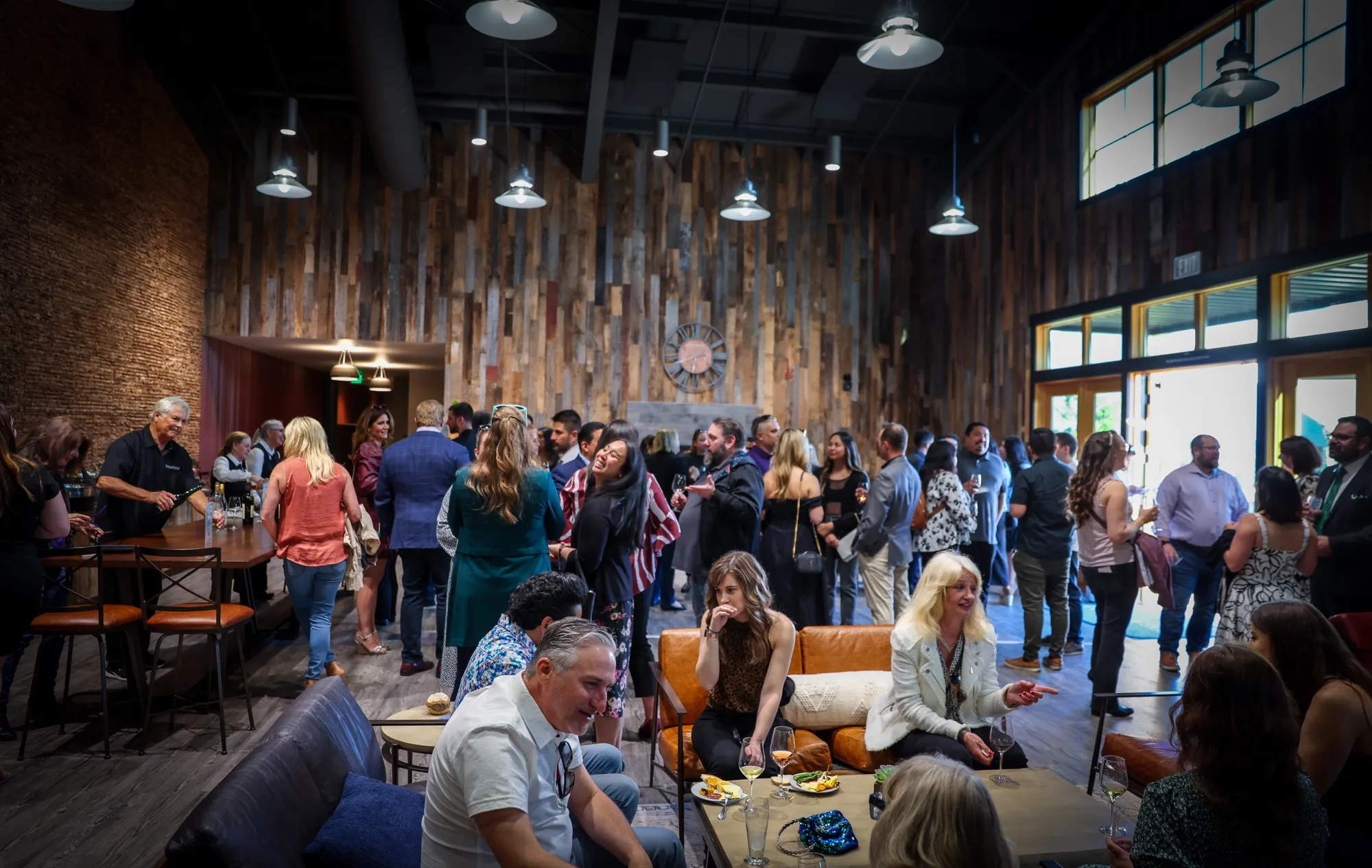 Guests gathered inside the Sugarloaf Wine Co. tasting room and lounge for a private event, indoor event venue, winery events, Santa Rosa, CA