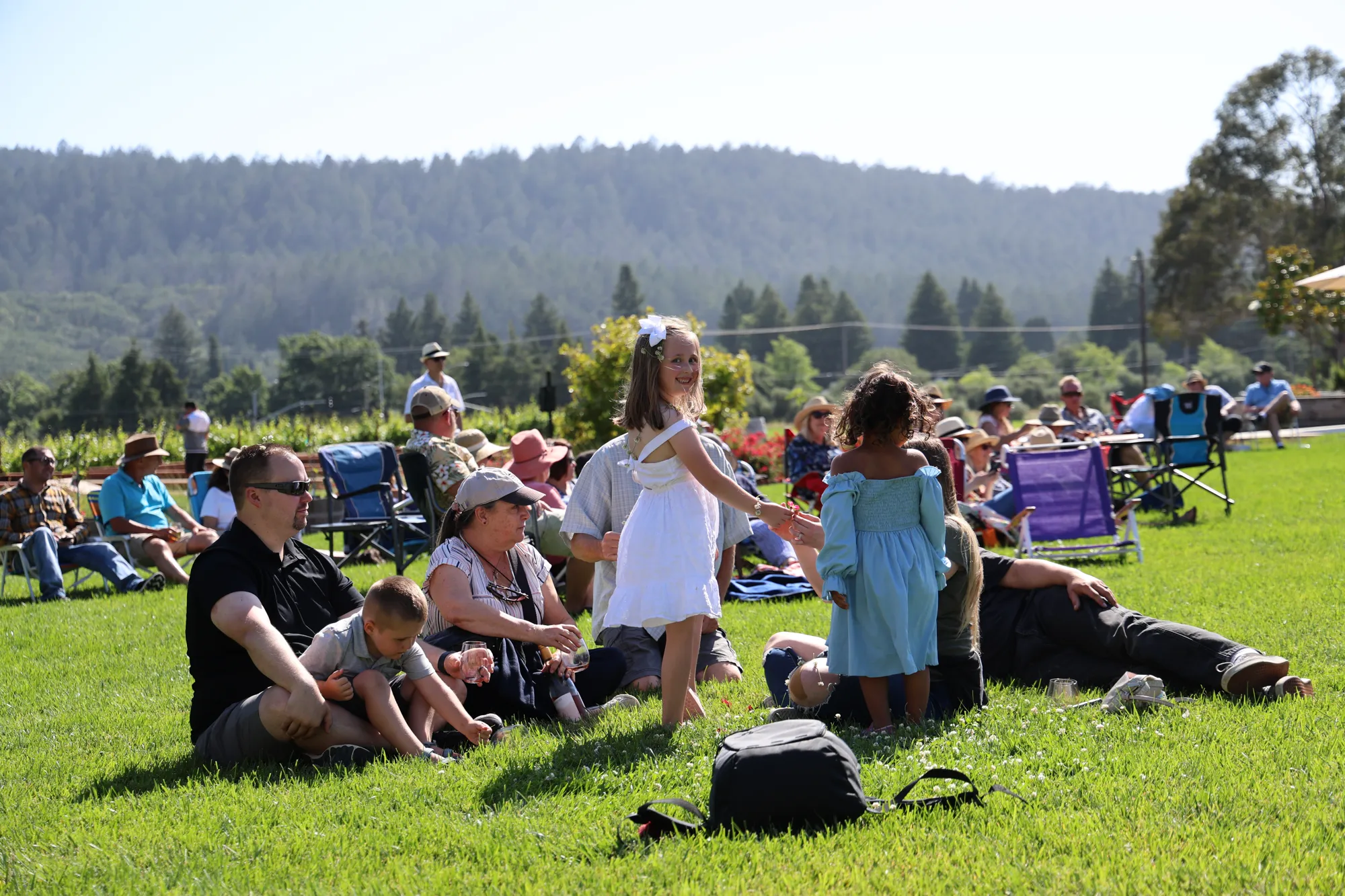 Children playing at Sugarloaf Wine Co winery's Sunday Social Club live music event