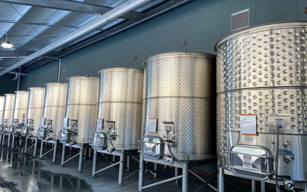 Stainless steel wine fermentation tanks at Sugarloaf Wine Co.